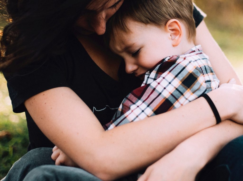 Woman comforting child